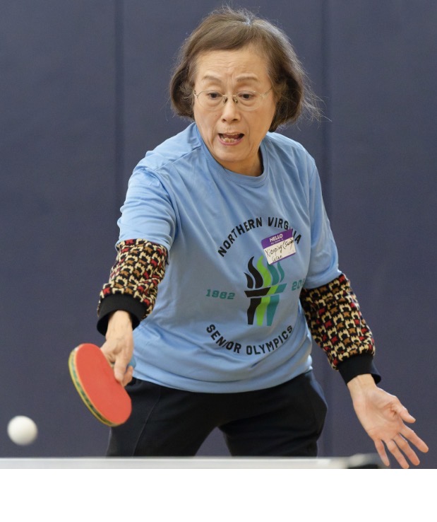 Susan returning ping pong serve.