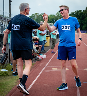 Men complete the 3 Mile Power Walk.